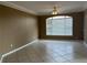 Bedroom featuring tile floors, neutral paint, and a large window at 4305 Bayside Village Dr # 301, Tampa, FL 33615