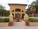 Grand community clubhouse entrance featuring a charming fountain and elegant architecture at 4305 Bayside Village Dr # 301, Tampa, FL 33615