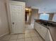 Open kitchen featuring tile floors and stainless steel sink at 4305 Bayside Village Dr # 301, Tampa, FL 33615