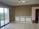 Living room featuring decorative wall molding, tile flooring and a balcony at 4305 Bayside Village Dr # 301, Tampa, FL 33615