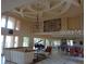Elegant lounge area with a grand piano, pool table, and comfortable seating at 4305 Bayside Village Dr # 301, Tampa, FL 33615