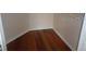 Walk-in closet with hardwood floors, base trim, and neutral walls at 4305 Bayside Village Dr # 301, Tampa, FL 33615