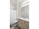 Bright bathroom featuring a shower, toilet, and a vanity with storage and ample counter space at 5006 Jackel Chase Dr, Wimauma, FL 33598