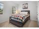 Cozy bedroom featuring a full size bed, a window, and neutral décor at 5006 Jackel Chase Dr, Wimauma, FL 33598