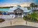The Southshore Bay entrance with tropical plants leading to a white-trimmed building and resort-style amenities at 5006 Jackel Chase Dr, Wimauma, FL 33598