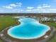 Expansive community lagoon offers a large swimming area with sandy beaches and surrounding community amenities at 5006 Jackel Chase Dr, Wimauma, FL 33598
