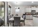 Dining area with stylish table set and sliding glass door to patio at 5006 Jackel Chase Dr, Wimauma, FL 33598