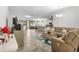 Spacious living area that flows into the dining and kitchen areas, with lots of seating at 5006 Jackel Chase Dr, Wimauma, FL 33598