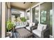 Inviting screened-in patio with comfortable seating and a stylish coffee table, perfect for outdoor living at 5006 Jackel Chase Dr, Wimauma, FL 33598