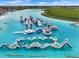 Community aqua park with modular inflatables including slides and climbing structures for active water recreation at 5006 Jackel Chase Dr, Wimauma, FL 33598