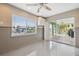 Bright bonus room with a ceiling fan and sliding doors to the lanai at 5070 Cedarbrook Ln, Hernando Beach, FL 34607