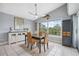 Dining room with view of the water, a stylish table, and custom furnishings for elegant entertaining at 5070 Cedarbrook Ln, Hernando Beach, FL 34607