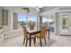 Dining room showing outdoor deck with stylish table set, water view and natural light at 5070 Cedarbrook Ln, Hernando Beach, FL 34607