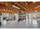 Spacious garage with exposed wood beams, and storage shelves with a golf cart at 5070 Cedarbrook Ln, Hernando Beach, FL 34607
