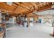 Bright garage with exposed wooden beams and enough space for lots of storage at 5070 Cedarbrook Ln, Hernando Beach, FL 34607