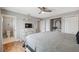 Spacious main bedroom with wood flooring, a ceiling fan, and a dresser for ample storage at 5070 Cedarbrook Ln, Hernando Beach, FL 34607