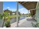 Inviting outdoor patio features canal view, seating, and lush greenery at 5070 Cedarbrook Ln, Hernando Beach, FL 34607