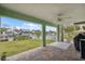 Relaxing covered patio with brick pavers overlooking a serene canal and lush landscaping at 5070 Cedarbrook Ln, Hernando Beach, FL 34607