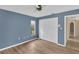 Cozy bedroom features hardwood floors, large closet and natural light at 5078 Florentine Ct, Spring Hill, FL 34608
