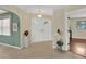 Spacious foyer featuring tile flooring, a decorative chandelier, and a view into the living area at 5078 Florentine Ct, Spring Hill, FL 34608
