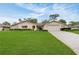 Charming single-story home boasting a well-manicured lawn, two-car garage, and stone accents at 5078 Florentine Ct, Spring Hill, FL 34608