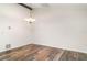 Classic dining room with neutral walls, wood-look floors, and a charming chandelier at 5084 Barrington Cir # 3202, Sarasota, FL 34234