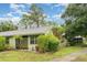 The single-story home boasts fresh landscaping, a well-manicured lawn, and mature trees at 5084 Barrington Cir # 3202, Sarasota, FL 34234