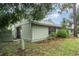 Back exterior view of home with fenced yard and lush, mature landscaping at 5084 Barrington Cir # 3202, Sarasota, FL 34234