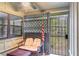 Enclosed patio featuring an outdoor ceiling fan, seating, and a secured gate for added privacy at 5084 Barrington Cir # 3202, Sarasota, FL 34234