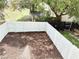 Backyard with new mulch is surrounded by a new white fence for privacy and security at 5229 Tennis Court Circle, Tampa, FL 33617