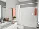 Bathroom with shower and tub combination and modern white vanity with granite countertop at 5229 Tennis Court Circle, Tampa, FL 33617