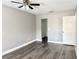 Bedroom with neutral walls, modern flooring, and closet with white door, ready for personalization at 5229 Tennis Court Circle, Tampa, FL 33617