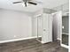 Bedroom with neutral walls, modern flooring, and closet with sliding mirror doors at 5229 Tennis Court Circle, Tampa, FL 33617