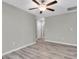 Neutral bedroom with modern fan and wood floors at 5432 Rainwood Meadows Dr, Apollo Beach, FL 33572