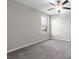 Bedroom featuring neutral walls, carpet flooring, and a window for natural light at 5432 Rainwood Meadows Dr, Apollo Beach, FL 33572