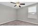 Bedroom featuring neutral walls, carpet flooring, and a window for natural light at 5432 Rainwood Meadows Dr, Apollo Beach, FL 33572