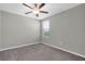 Bedroom featuring neutral walls, carpet flooring, and a window for natural light at 5432 Rainwood Meadows Dr, Apollo Beach, FL 33572