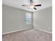 Neutral bedroom with modern fan and carpet at 5432 Rainwood Meadows Dr, Apollo Beach, FL 33572