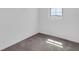Bedroom featuring neutral walls, carpet flooring, and a window for natural light at 5432 Rainwood Meadows Dr, Apollo Beach, FL 33572