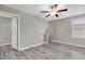 Neutral bedroom with modern fan and wood floors at 5432 Rainwood Meadows Dr, Apollo Beach, FL 33572