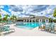 Resort-style community pool with lounge chairs, shaded areas, and a clubhouse for relaxing by the water at 5432 Rainwood Meadows Dr, Apollo Beach, FL 33572