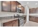 Beautiful kitchen featuring granite countertops, stainless steel appliances, and ample cabinet space at 5432 Rainwood Meadows Dr, Apollo Beach, FL 33572