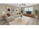 Cozy living room featuring a comfortable sectional sofa, contemporary decor, and ample natural light at 5432 Rainwood Meadows Dr, Apollo Beach, FL 33572