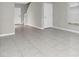 Tiled living room with windows, great natural light and neutral paint at 5432 Rainwood Meadows Dr, Apollo Beach, FL 33572