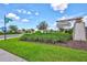 Landscaped community entrance with signage and flowerbeds, creating a welcoming first impression at 5432 Rainwood Meadows Dr, Apollo Beach, FL 33572