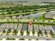 Aerial view of property showcasing its location near a lake and well-kept neighborhood at 5511 Del Coronado Dr, Apollo Beach, FL 33572