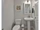 Bathroom featuring stylish pedestal sink, a patterned tile floor, white walls, and minimalist decor at 5511 Del Coronado Dr, Apollo Beach, FL 33572