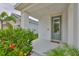 Welcoming front entrance with stylish door, columns and colorful landscaping at 5511 Del Coronado Dr, Apollo Beach, FL 33572