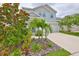 Inviting two-story home with lush landscaping and a pristine driveway at 5511 Del Coronado Dr, Apollo Beach, FL 33572