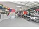 Spacious garage with golf cart, motorcycles, and ample storage for recreational gear at 5511 Del Coronado Dr, Apollo Beach, FL 33572